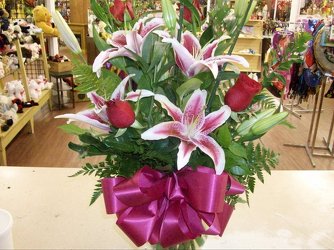 Red roses and lilies from Bunn Flowers & Gifts, local florist in Pittsburg, TX
